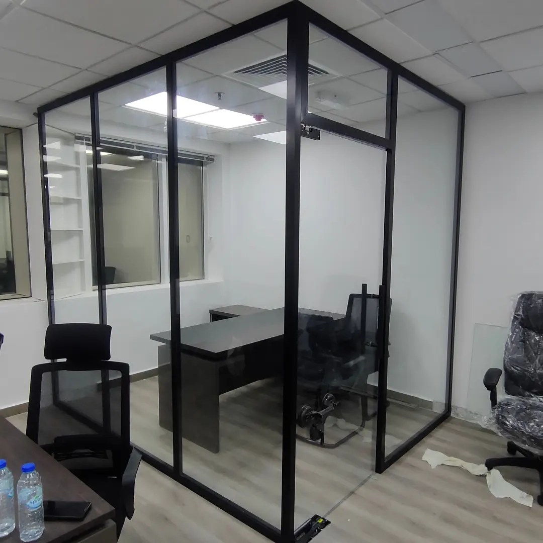 Office Glass Partition Dubai with black aluminium frame